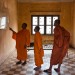 Buddhist monks visiting the Tuol Sleng Genocide museum