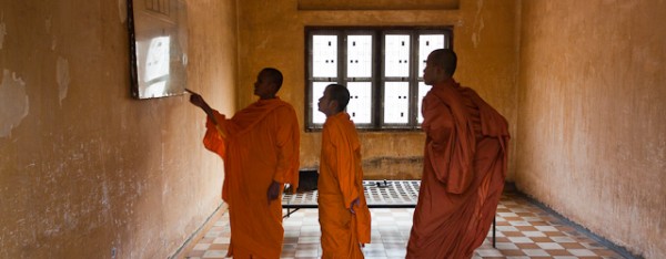 Buddhist monks visiting the Tuol Sleng Genocide museum